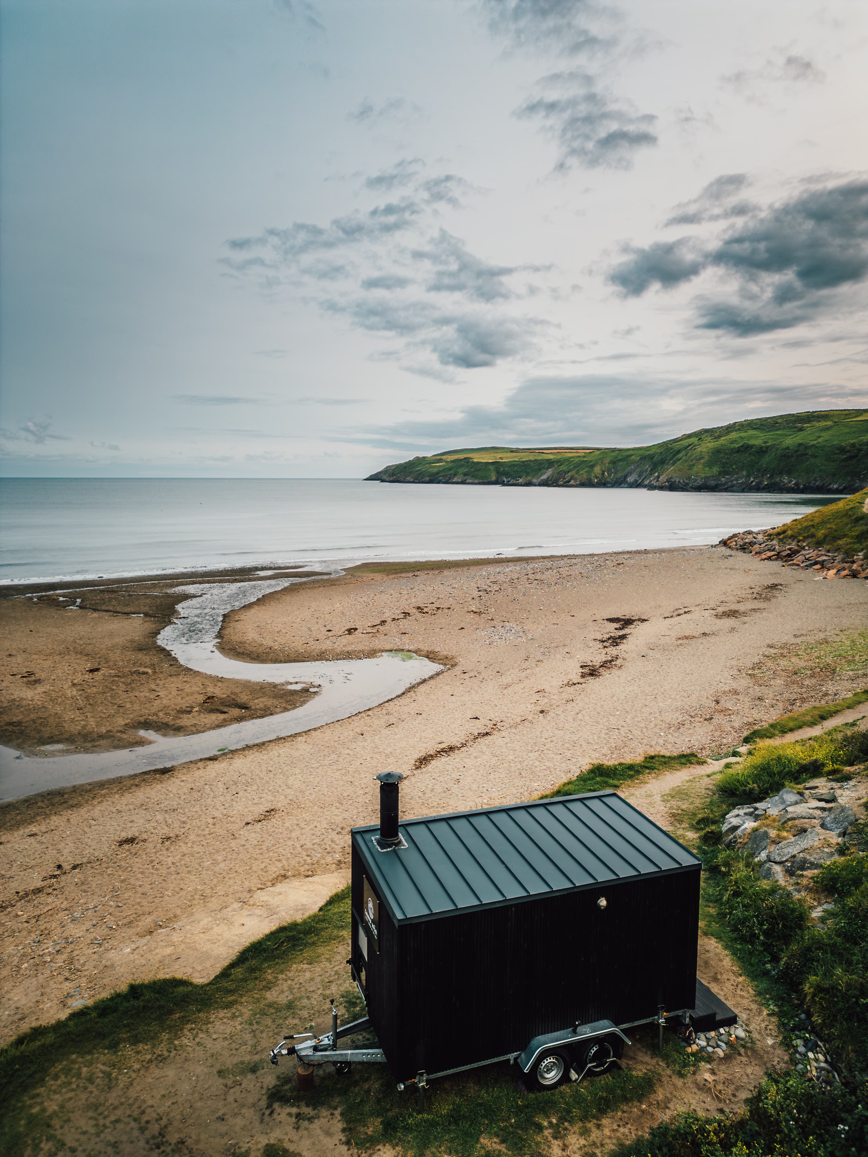 bespoke sauna on trailer at beautiful beach
